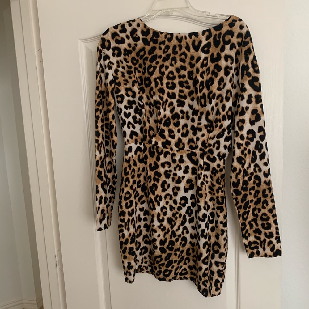 Beautiful new night club or cocktail dress. It has an opening on the back